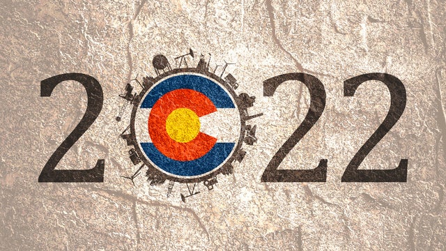 2022 year number with industrial icons around zero digit. Flag of Colorado. 