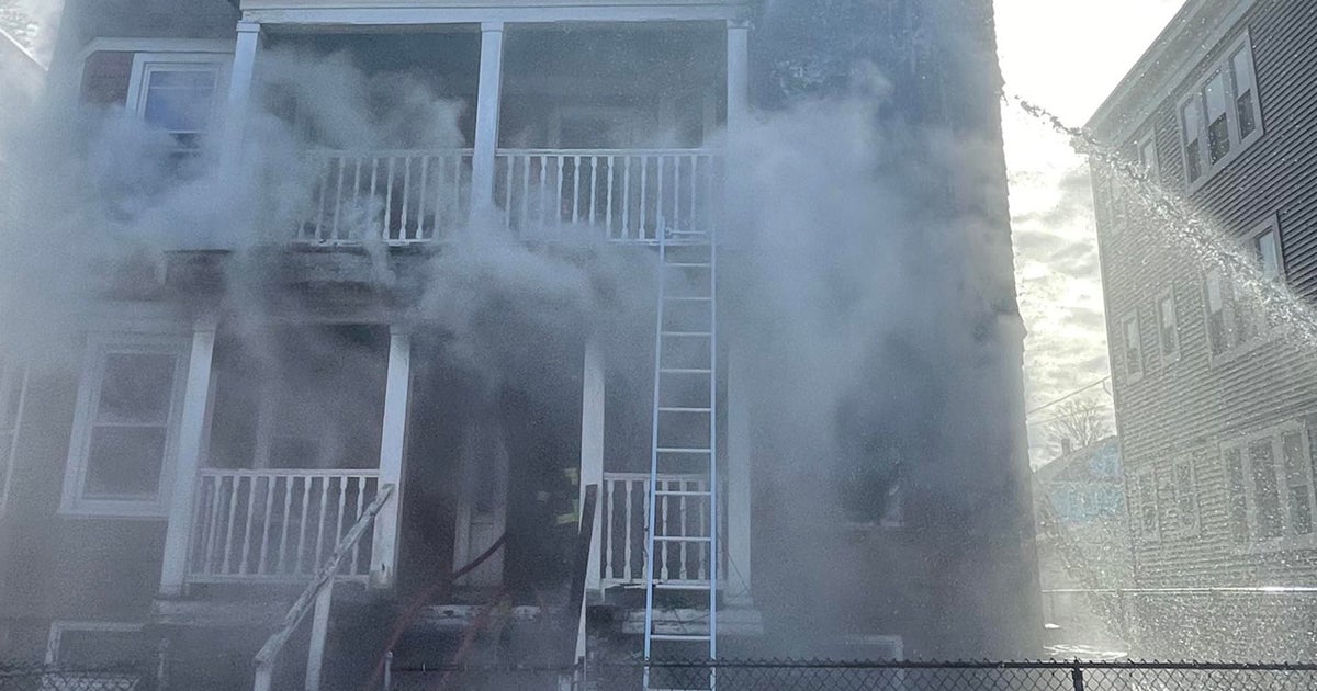Boston firefighters save 2 from burning Dorchester home, woman arrested
