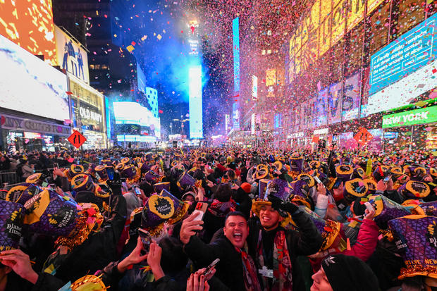 Revelers celebrate New Year's Eve in Times Square as confetti falls on January 01, 2023 in New York City. 