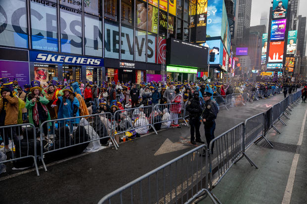 Revelers wait in pens after arriving more than 8 hours early ahead of New Year's Eve celebration in Times Square on December 31, 2022 in New York City. 