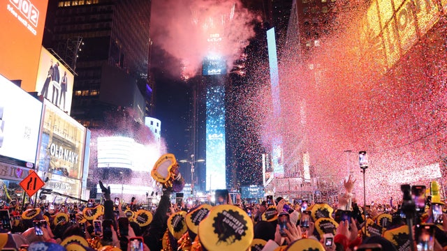 Onlookers watch as confetti fills the air to mark the beginning of the new year, in Times Square, New York City, on January 1, 2023.