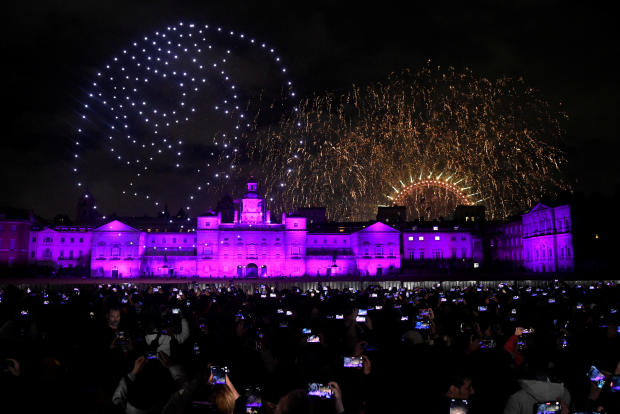 People record a drone image of Britain's late Queen Elizabeth II, during New Year's celebrations in central London, Britain. January 1, 2023. 