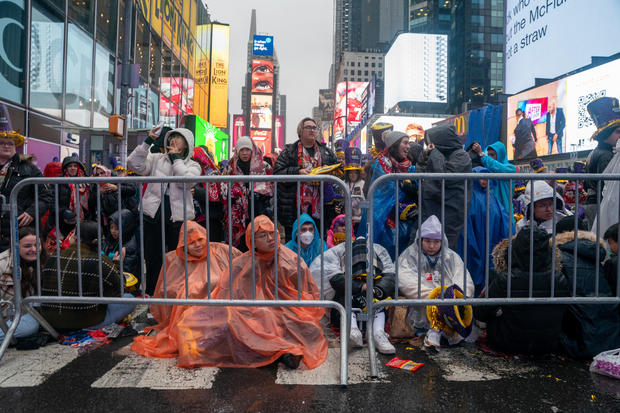 Revelers wait in the rain at Times Square for the midnight ball drop for the New Year's Eve celebration on December 31, 2022 in New York City. 