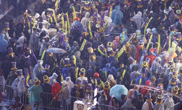 Revelers stand in the rain as they celebrate New Year's Eve in Times Square on December 31, 2022, in New York City. 