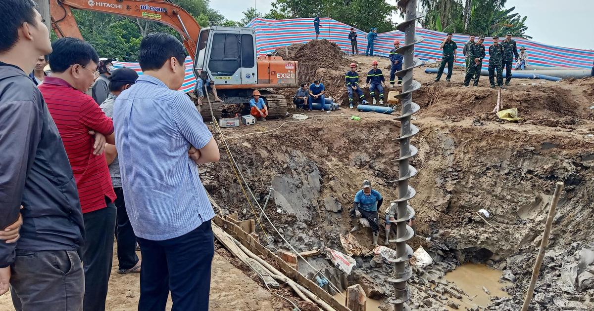 Rescuers race to save boy who fell into 115-foot shaft in Vietnam