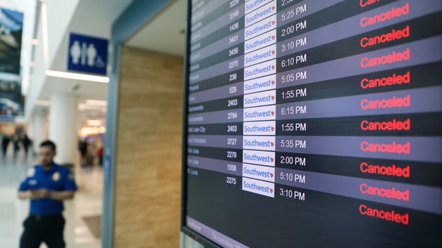 Canceled Southwest Airlines flights appear on the monitors at LAX on Thursday, December 29, 2022.