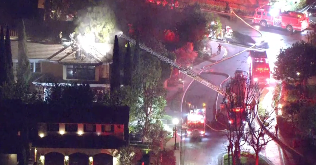 Firefighters battle fire at two-story home in Bel Air - CBS Los Angeles