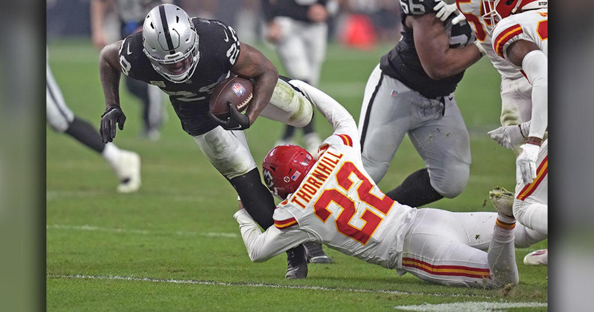 Kansas City Chiefs safety Juan Thornhill (22) tackles Cincinnati