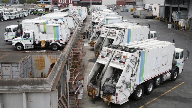 Recycling collection trucks are parked in a Recology maintenance yard on Seventh Street in San Francisco, Calif. on Thursday, Aug. 30, 2018 which it hopes to shut down and develop housing in its place 