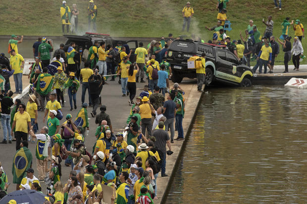 Supporters of former Brazilian President Jair Bolsonaro storm governmental buildings 