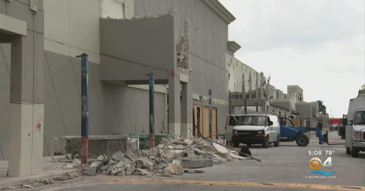Two Hialeah building workers slide from 25-foot-high elevate