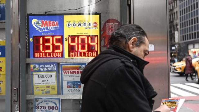 Mega Millions sign and lottery tickets are seen at a newsstand in New York, United States on January 12, 2023. 