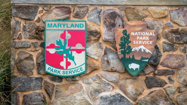 A wall with Maryland Park Service and National Park Service signs at Harriet Tubman Visitor Center 