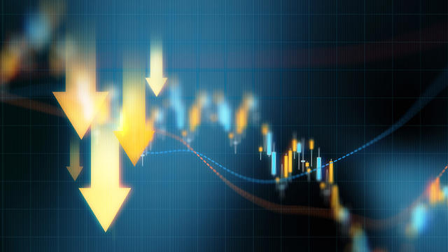 Investment And Finance Concept - Yellow Down Arrows Over Blue Financial Graph Background 