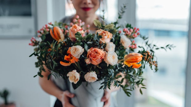 woman holding flower bouquet 