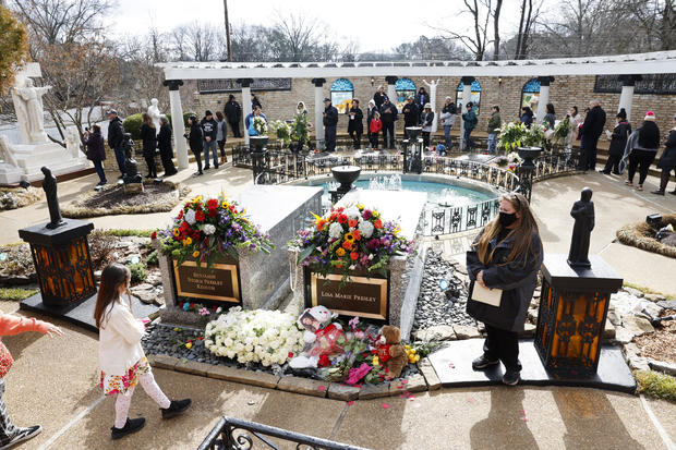 Fans visit the grave of Lisa Marie Presley at Graceland during her memorial on Jan. 22, 2023, in Memphis, Tennessee. 