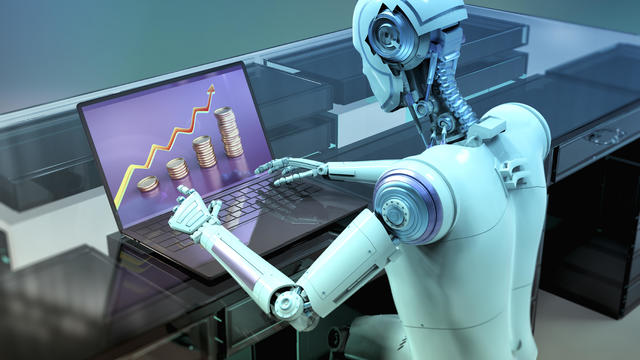Humanoid robot working with laptop, conceptual illustration 