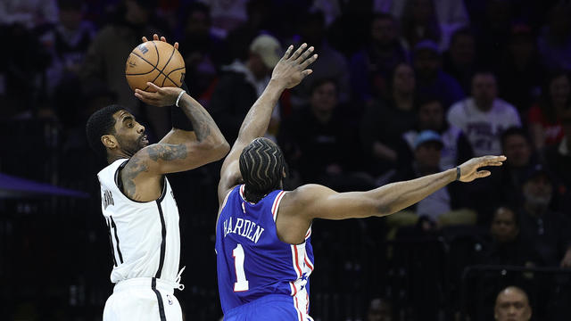 Kyrie Irving #11 of the Brooklyn Nets shoots over James Harden #1 of the Philadelphia 76ers during the first quarter at Wells Fargo Center on January 25, 2023 in Philadelphia, Pennsylvania. 