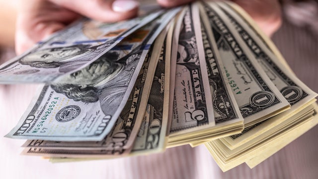 United States dollar banknotes are seen in this illustration photo taken in Poland on December 26, 2022. 