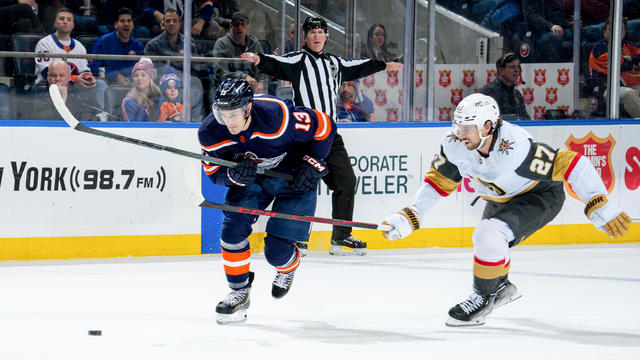 Mathew Barzal #13 of the New York Islanders is pursued by Shea Theodore #27 of the Vegas Golden Knights during the first period at UBS Arena on January 28, 2023 in Elmont, New York. 