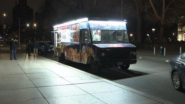 A halal food truck sit parked outside Union Square Park. 