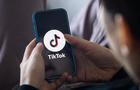 In this photo illustration, a TikTok App Logo is displayed 