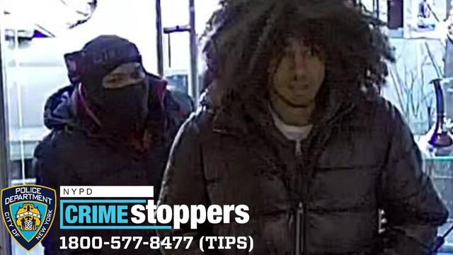 Two individuals wanted in connection to a smoke shop robbery in Brooklyn. 