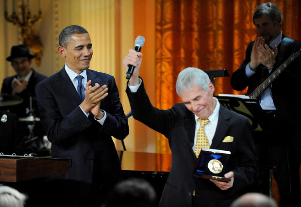 Burt Bacharach reacts to applause after receiving the 2012 Library of Congress Gershwin Prize for Popular Song from President Barack Obama during a concert in the East Room of the White House honoring Bacharach and his songwriting partner Hal David, in Wa 