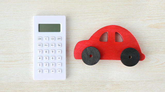 Calculator and red car toy 