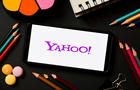 In this photo illustration a Yahoo logo seen displayed on a 
