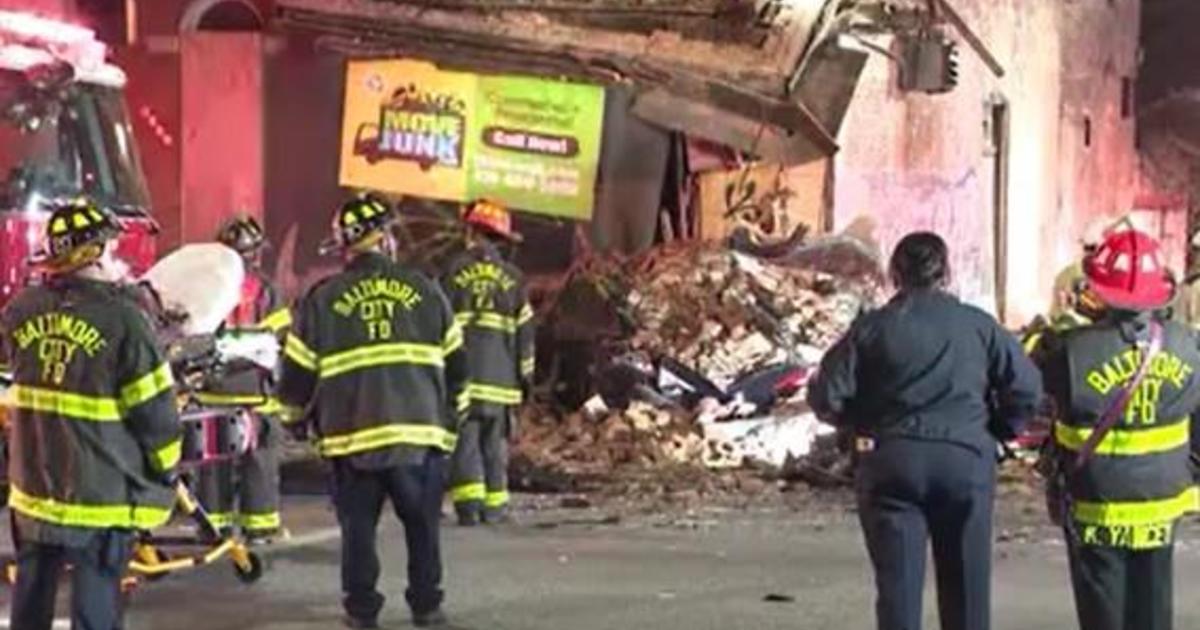 Man dead, several people hurt after cars crash into Baltimore building that partially collapses