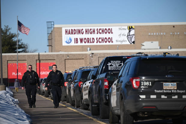 Police officers are seen outside Harding High School in St. Paul, Minnesota, following a stabbing on February 10, 2023. 