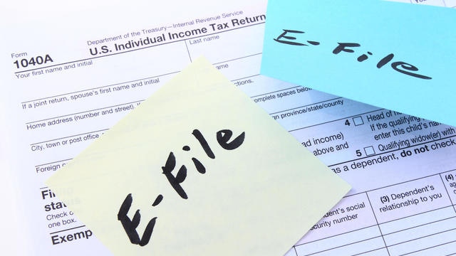 Tax form 1040A with E-file sticky notes 