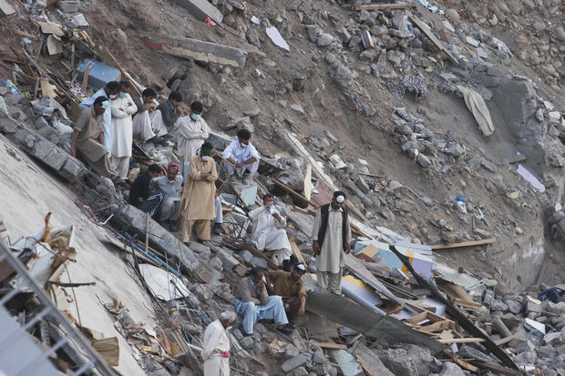 Men Searching For Corpses After The 8 October 2005 Earthquake. 