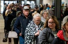People wait in line at the Norfolk Southern Assistance Center to collect a $1000 check and get reimbursed for expenses on Feb. 17, 2023, in East Palestine, Ohio. 