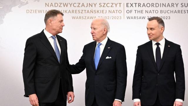 President Biden poses during a group photo with the Polish President Andrzej Duda and Romanian President Klaus Iohannis at the Presidential Palace in Warsaw on Feb. 22, 2023. 