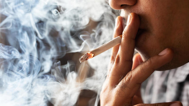 Close-Up Of Man Smoking Cigarette 