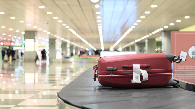 Luggage On Conveyor Belt At Airport 