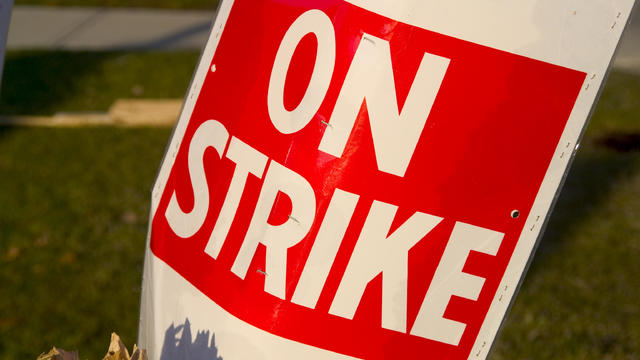 On a Strike sign in red and white poster 