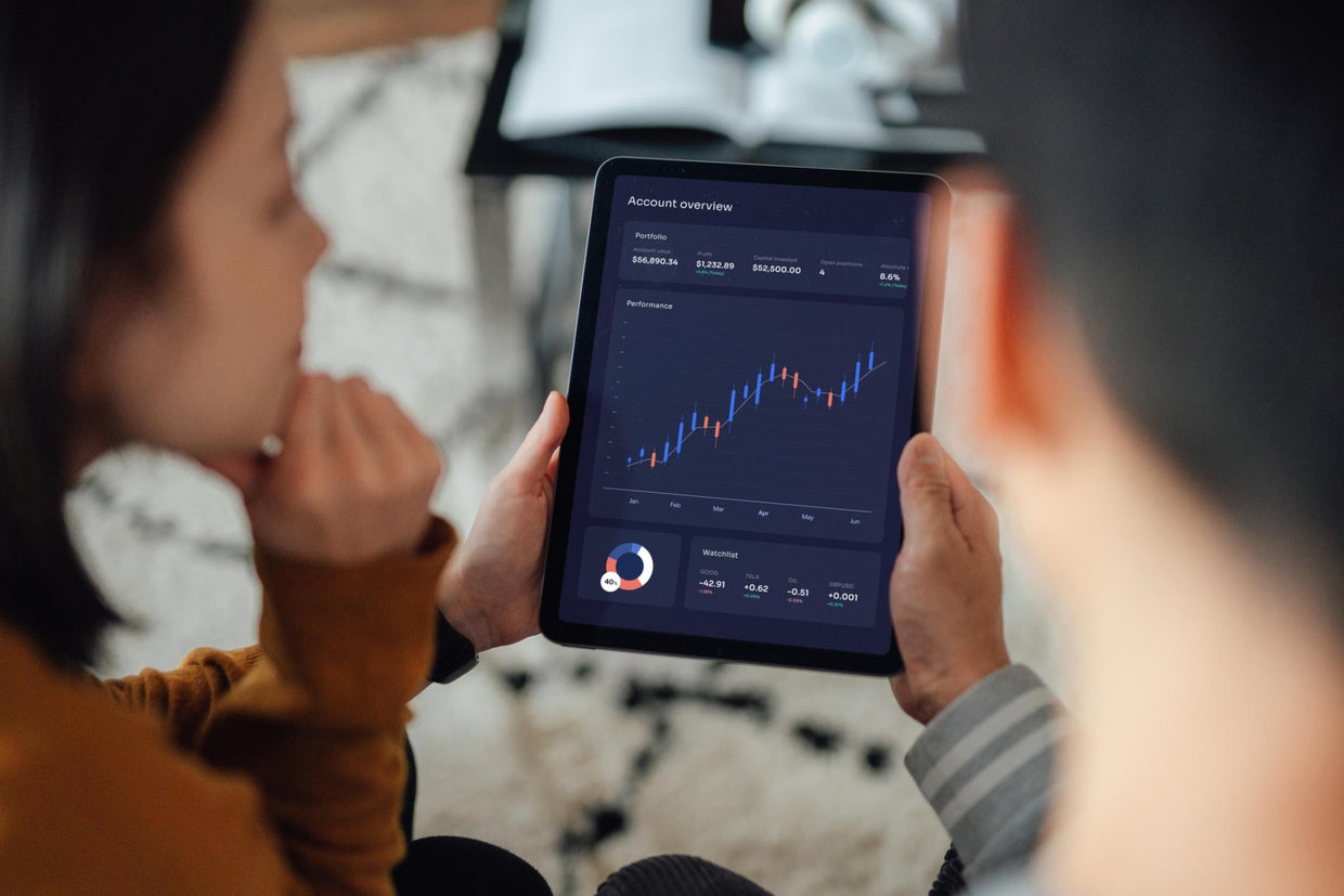 Young couple making financial plans with digital tablet 