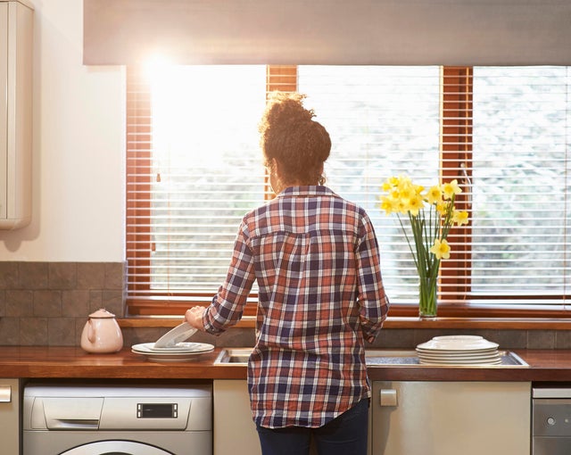 Woman cleaning kitchen 