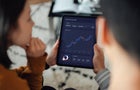 Young couple making financial plans with digital tablet 