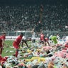 Fans throw toys on the soccer pitch for children affected by earthquake during a match, in Istanbul 