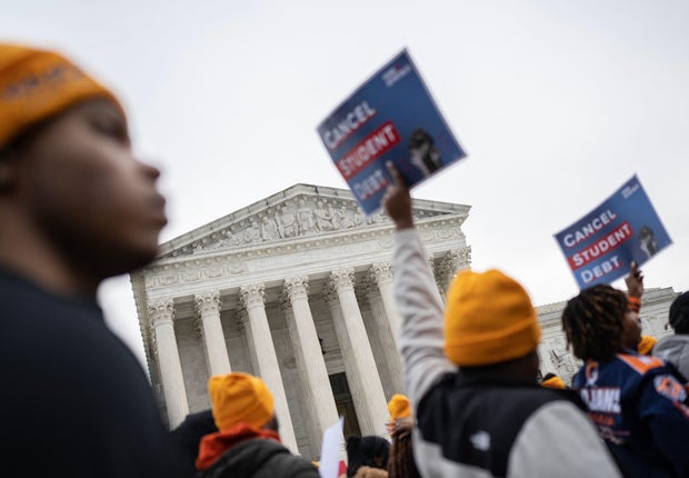 Activists and students protest in front of the Supreme Court during a rally for student debt cancelation in Washington, D.C., on Feb. 28, 2023. 