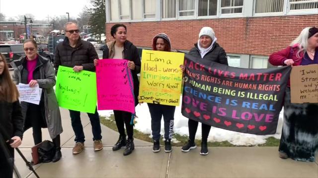 Protesters hold signs in Rockland County. 