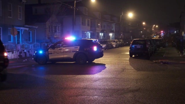A Paterson Police vehicle blocks off a residential street. 