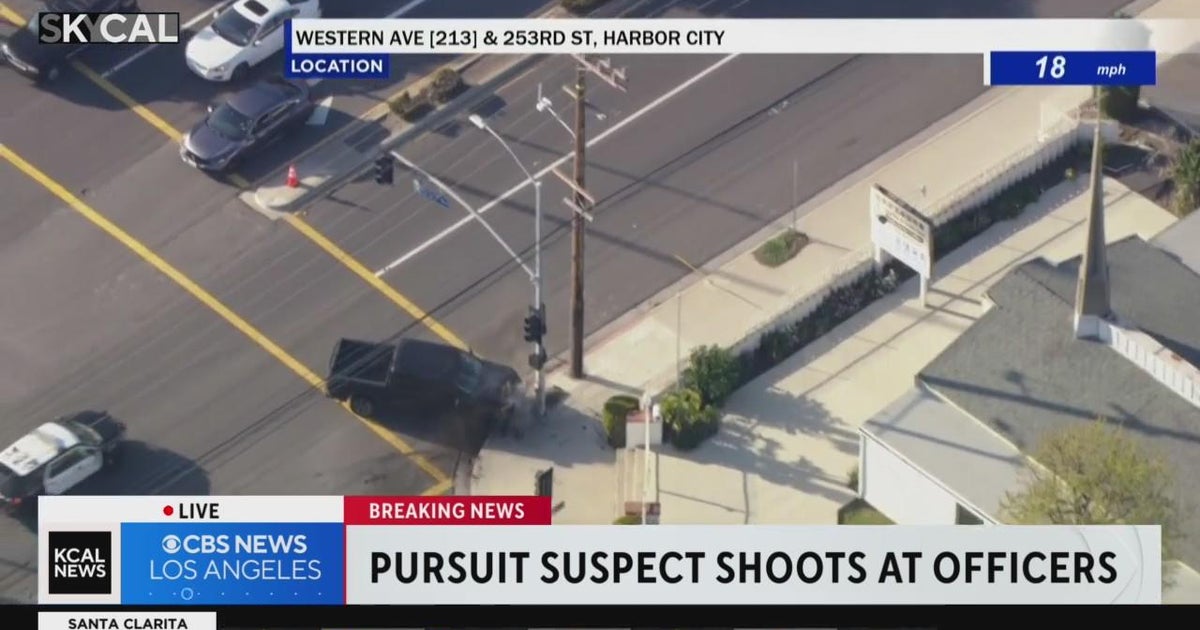 Suspect crashes into law enforcement vehicle, slams into light pole ...