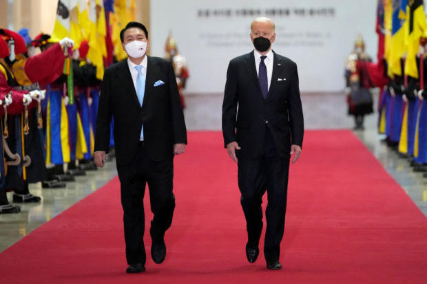 President Biden and South Korean President Yoon Suk Yeol arrive at the National Museum of Korea for a state dinner on May 21, 2022, in Seoul, South Korea. 