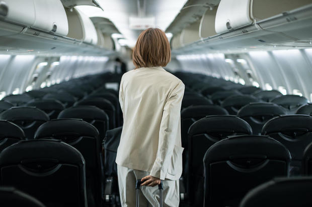 Businesswoman traveling on an airplane to a business destination 