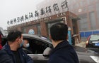 Members of the World Health Organization team investigating the origins of the coronavirus arrive by car at the Wuhan Institute of Virology on Feb. 3, 2021. 